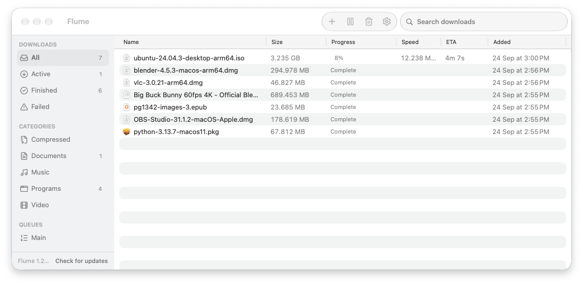 Flume's main window: downloads sorted by category, one in progress